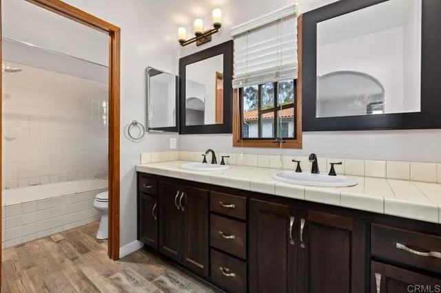 a bathroom with a toilet and a bathtub