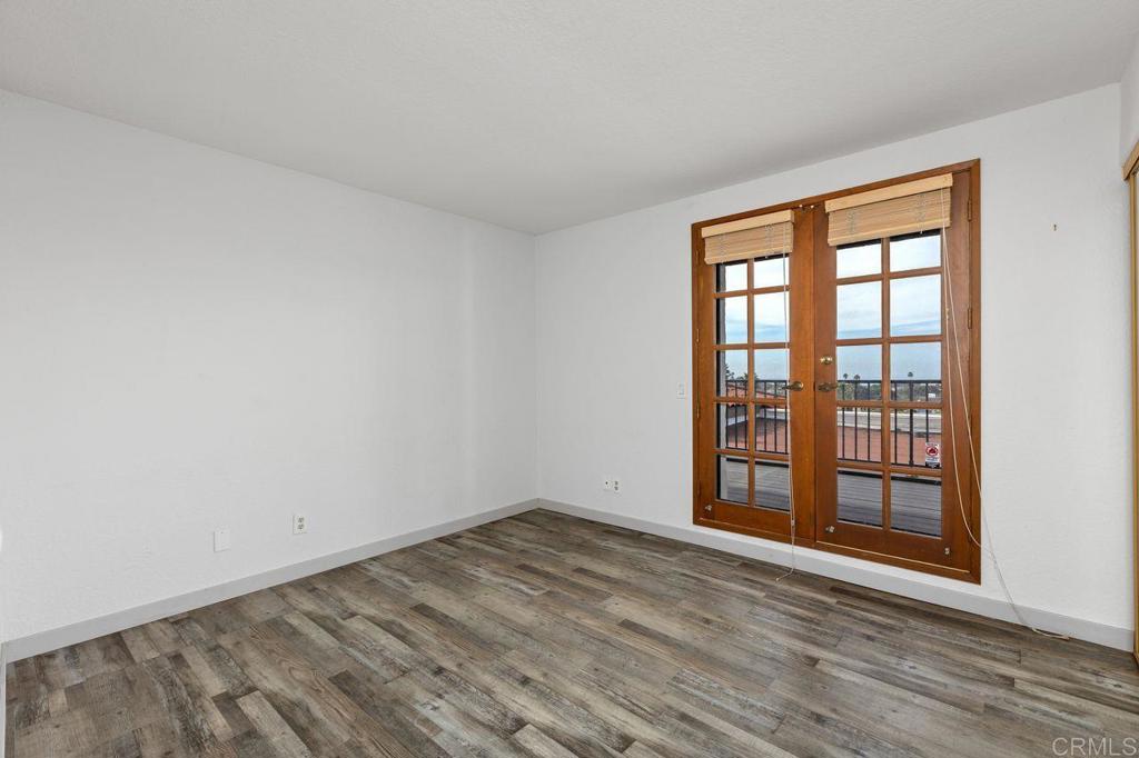 406 Paseo Pacifica Encinitas, CA 92024 - Photo 24 of 53 wooden floor in an empty room with a window