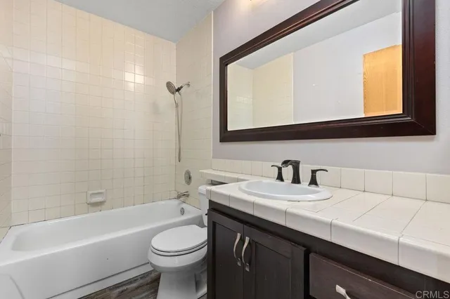 a roof deck with table and chairs