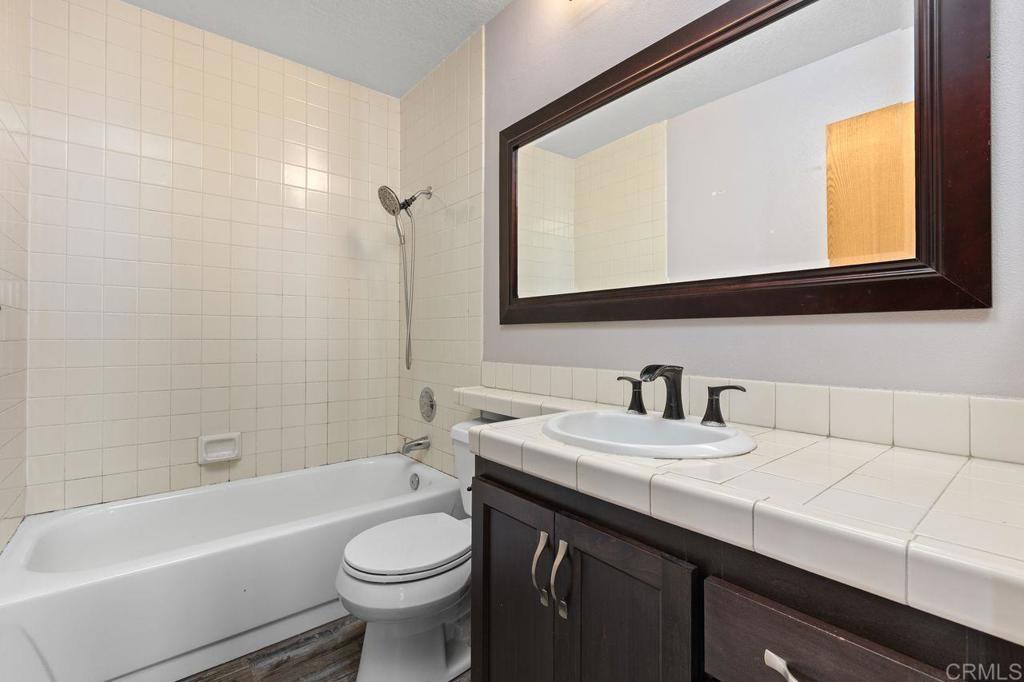 406 Paseo Pacifica Encinitas, CA 92024 - Photo 25 of 53 a bathroom with a sink a toilet and a bathtub