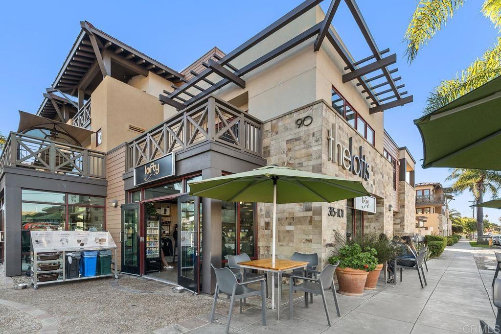 406 Paseo Pacifica Encinitas, CA 92024 - Photo 42 of 53 a view of a patio with a table and chairs under an umbrella