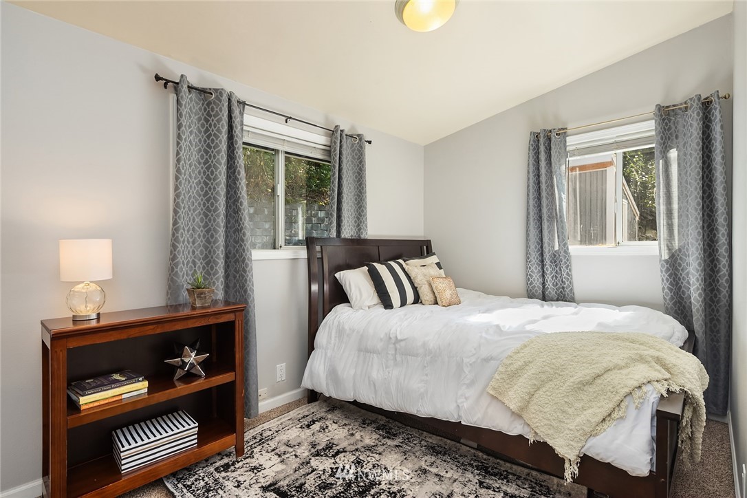 22519 Southeast Bain Road Maple Valley, WA 98038 - Photo 8 of 15 a bedroom with a bed and a window