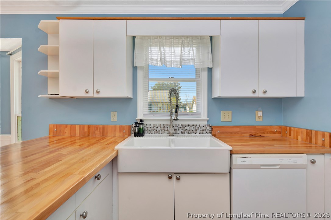 532 Blackbird Road Fayetteville, NC 28314 - Photo 11 of 38 a kitchen with stainless steel appliances granite countertop a sink stove and cabinets