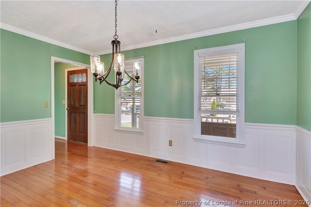 532 Blackbird Road Fayetteville, NC 28314 - Photo 15 of 38 a view of an empty room with wooden floor and windows