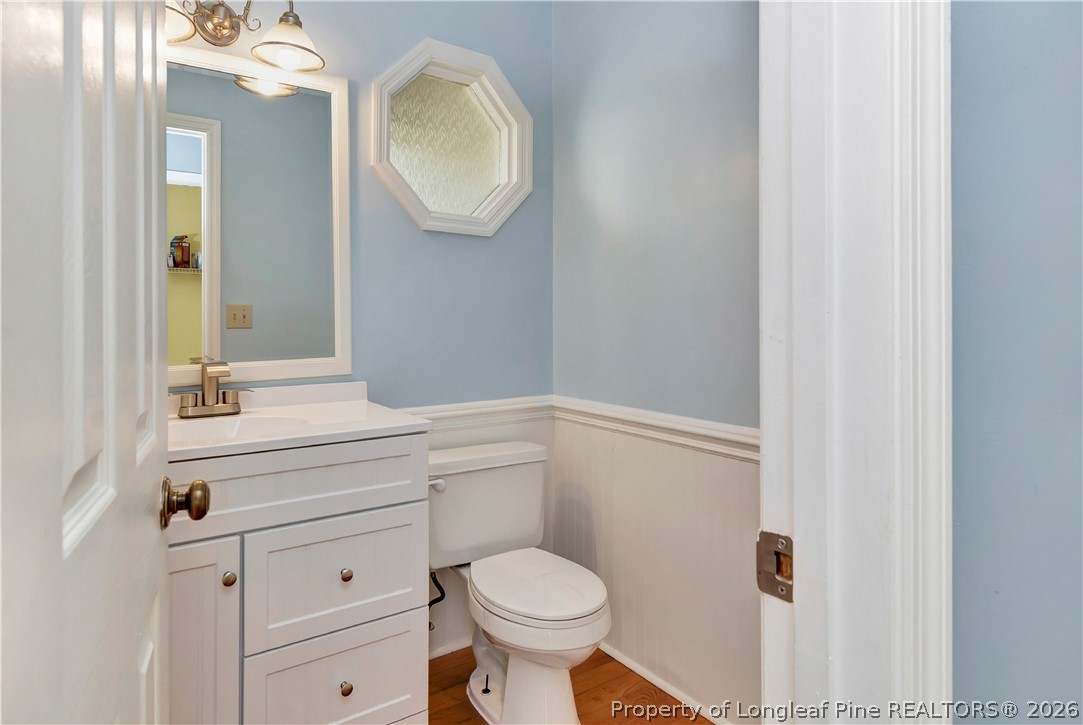 532 Blackbird Road Fayetteville, NC 28314 - Photo 18 of 38 a bathroom with a toilet a sink and mirror