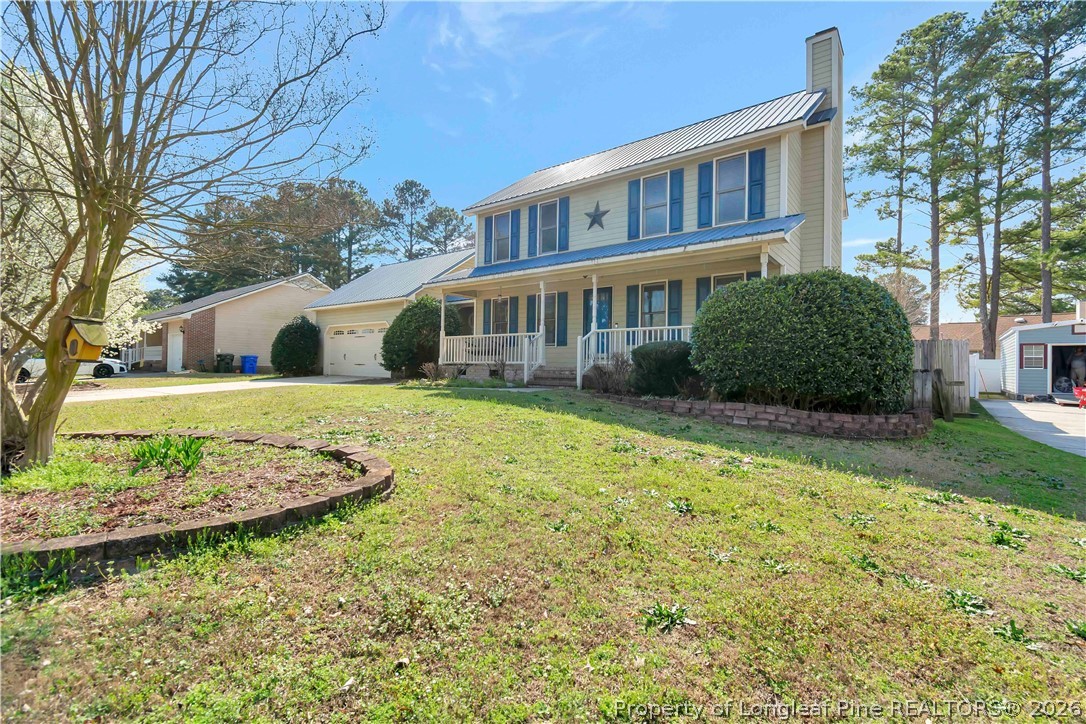 532 Blackbird Road Fayetteville, NC 28314 - Photo 2 of 38 a view of a house with a garden and pathway