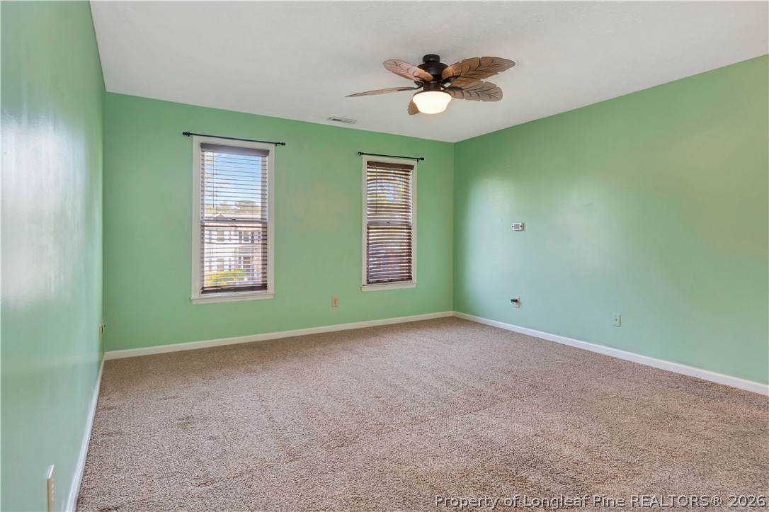 532 Blackbird Road Fayetteville, NC 28314 - Photo 21 of 38 an empty room with window and ceiling fan