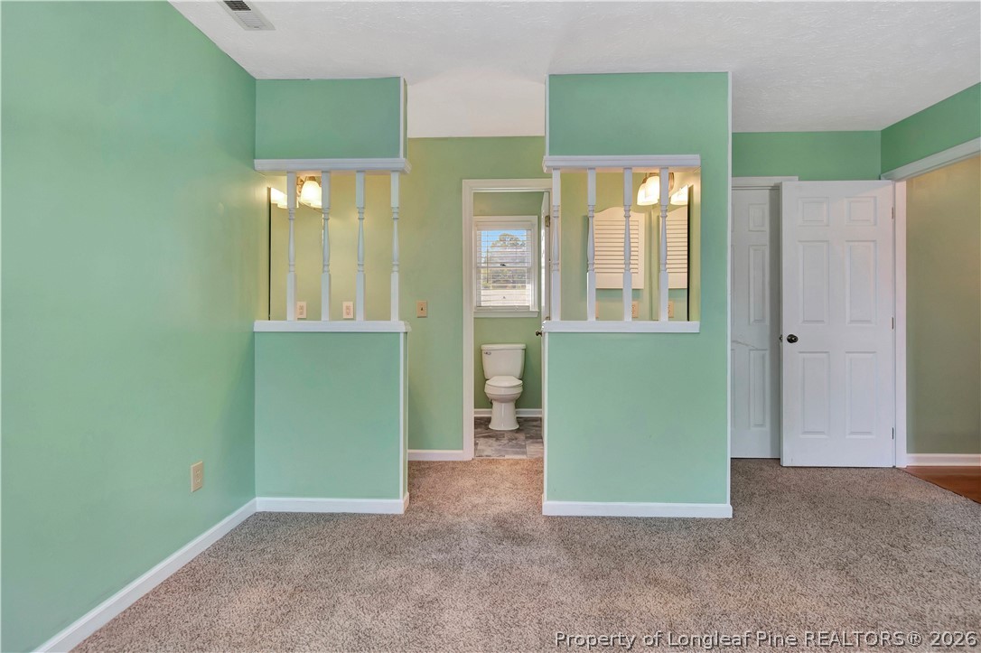 532 Blackbird Road Fayetteville, NC 28314 - Photo 22 of 38 a view of an empty room with window and bathroom
