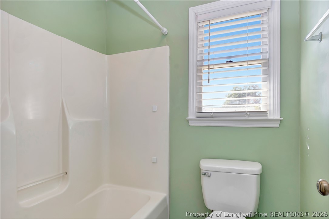 532 Blackbird Road Fayetteville, NC 28314 - Photo 23 of 38 a bathroom with a toilet and a bathtub