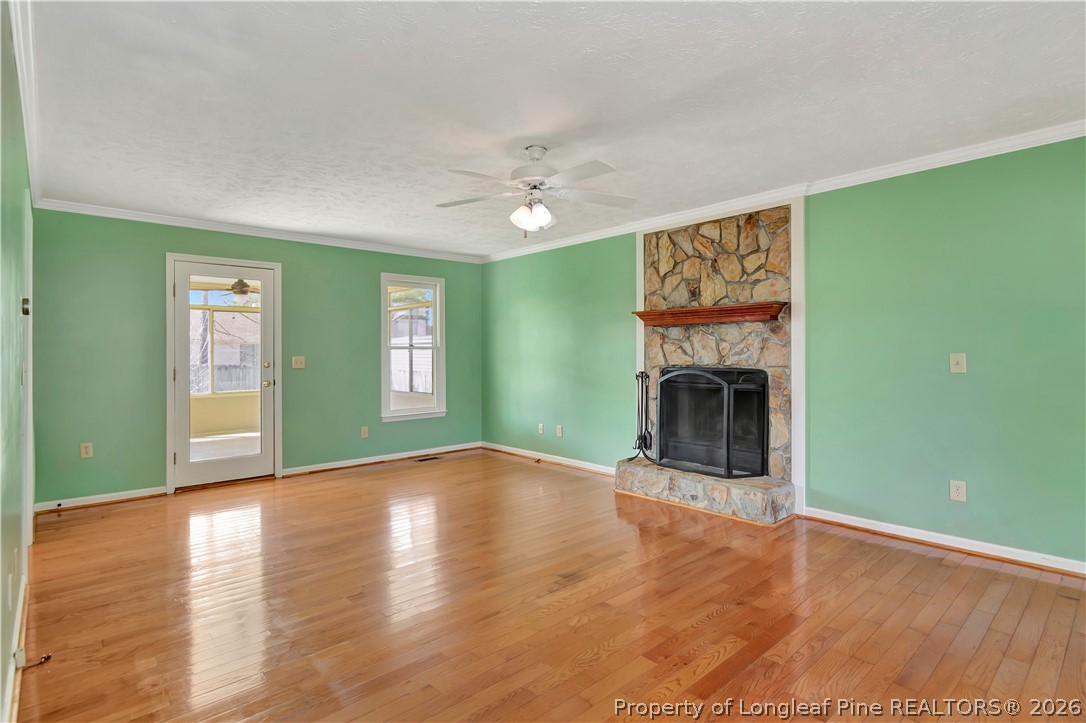 532 Blackbird Road Fayetteville, NC 28314 - Photo 7 of 38 a view of empty room with fireplace and fan