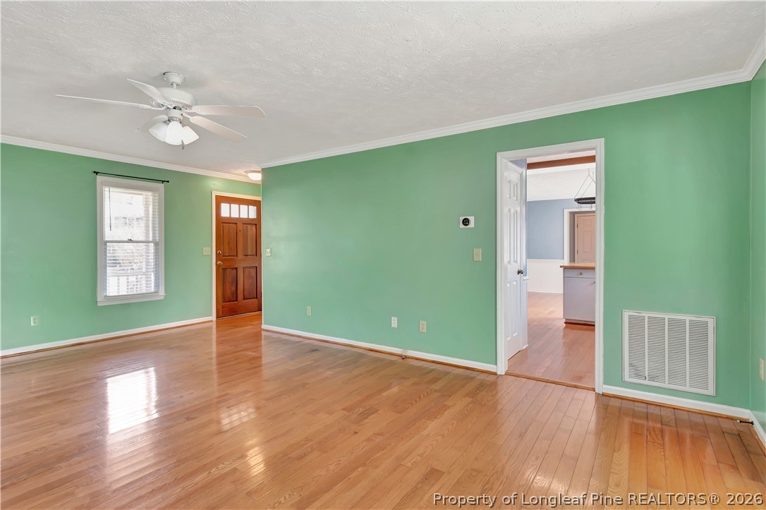 532 Blackbird Road Fayetteville, NC 28314 - Photo 9 of 38 a view of an empty room with window and wooden floor