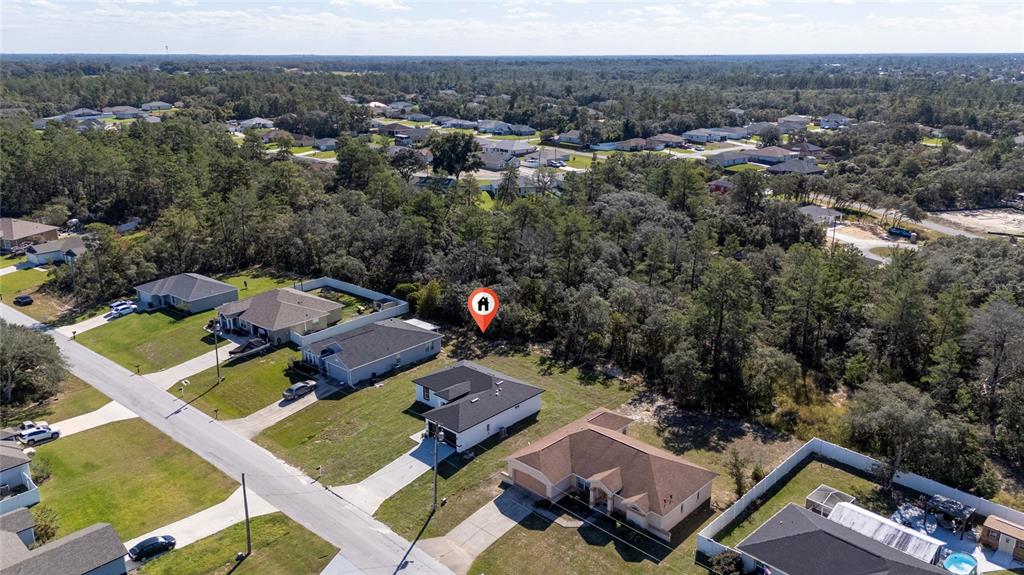 13069 Southwest 35th Circle Ocala, FL 34473 - Photo 36 of 41 an aerial view of a house with a mountain
