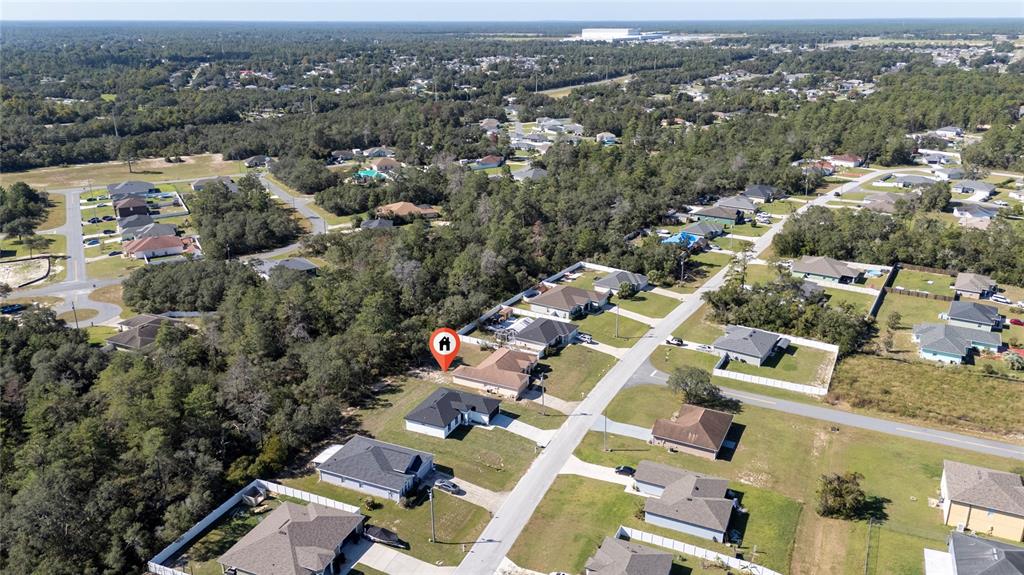 13069 Southwest 35th Circle Ocala, FL 34473 - Photo 40 of 41 an aerial view of residential houses with outdoor space