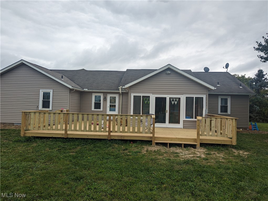 2291 Armstrong Road Wooster, OH 44691 - Photo 23 of 23 Rear view of property with a deck, a lawn, and roof with shingles