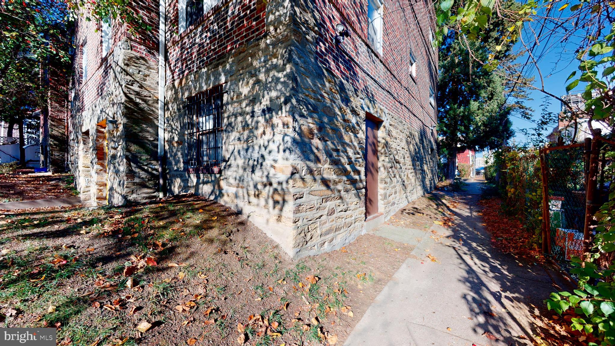 2415 80th Avenue Philadelphia, PA 19150 - Photo 14 of 15 a backyard of a house with lots of green space