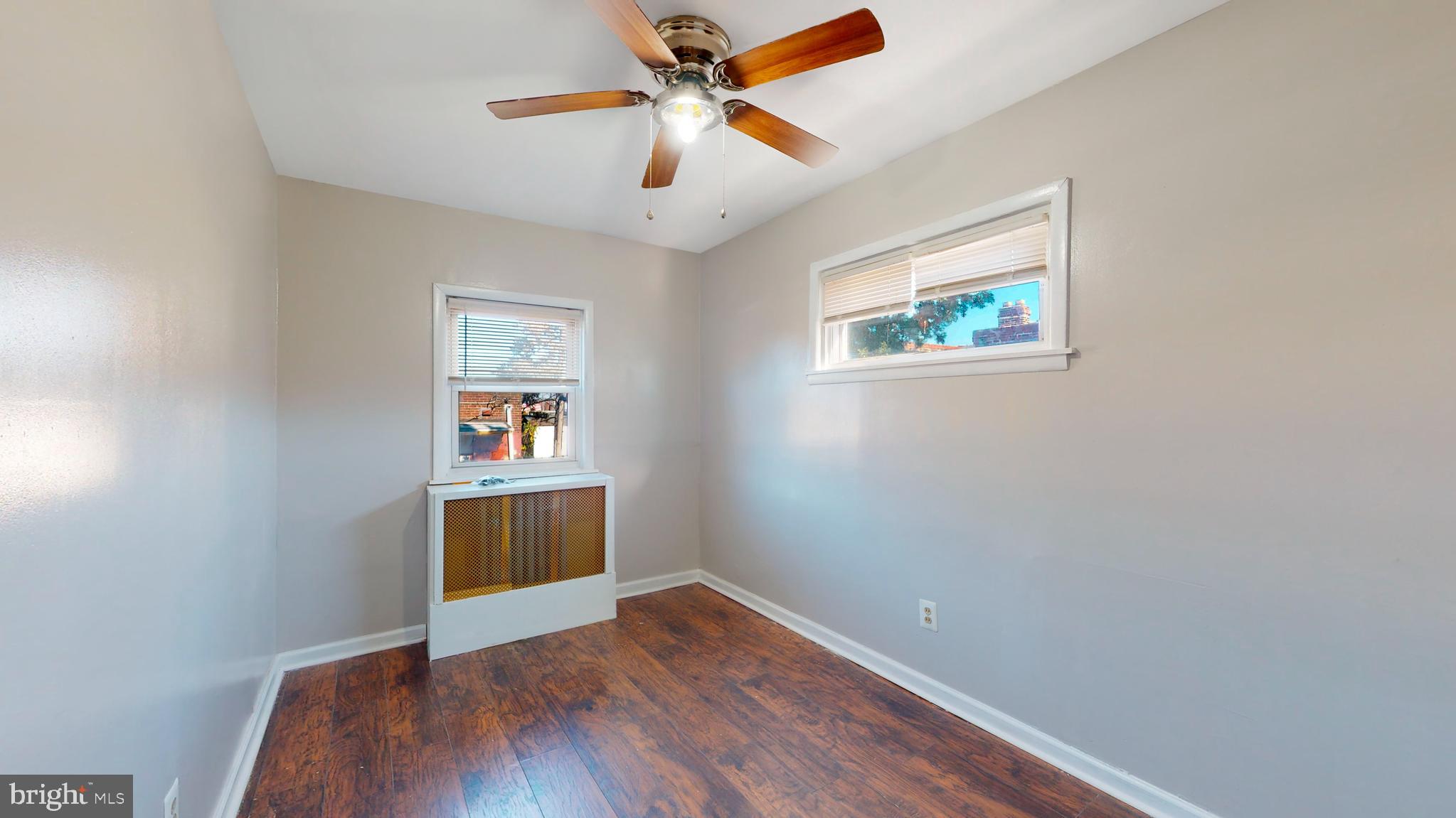 2415 80th Avenue Philadelphia, PA 19150 - Photo 10 of 15 wooden floor in an empty room with a window