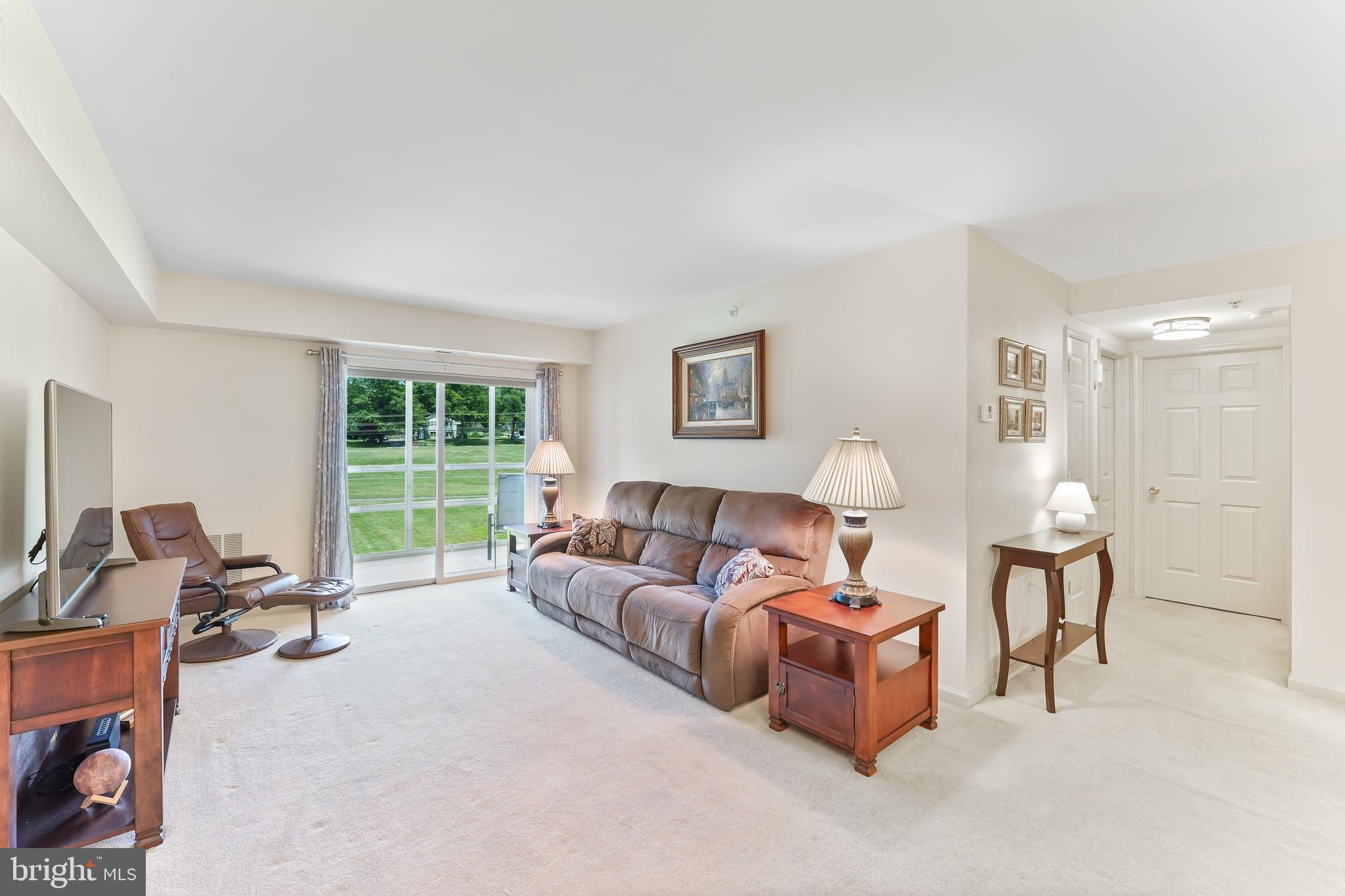 652 Brandon Road Eagleville, PA 19403 - Photo 3 of 29 Living Room with Door to the Screened Patio