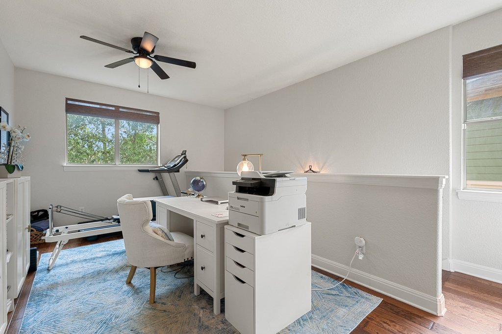 6708 Menchaca Road, Unit 2 Austin, TX 78745 - Photo 16 of 30 Bright interior space featuring wood-finish flooring and a contemporary ceiling fan with integrated lighting