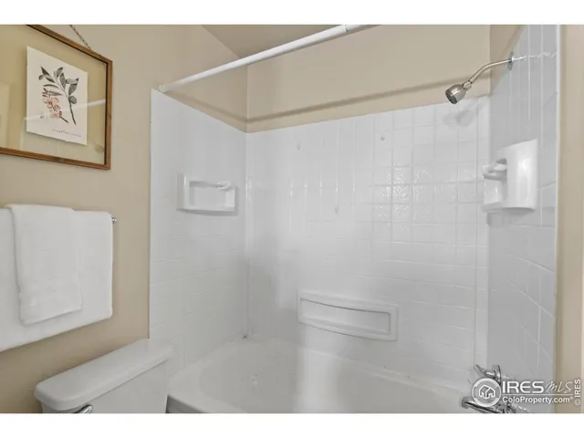 a view of a patio with a table and chairs