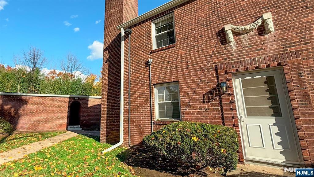 a view of house with backyard