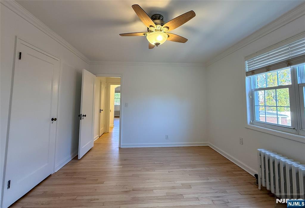 63 West Hudson Avenue, Unit C5 Englewood, NJ 07631 - Photo 15 of 19 a view of an empty room with wooden floor and a window