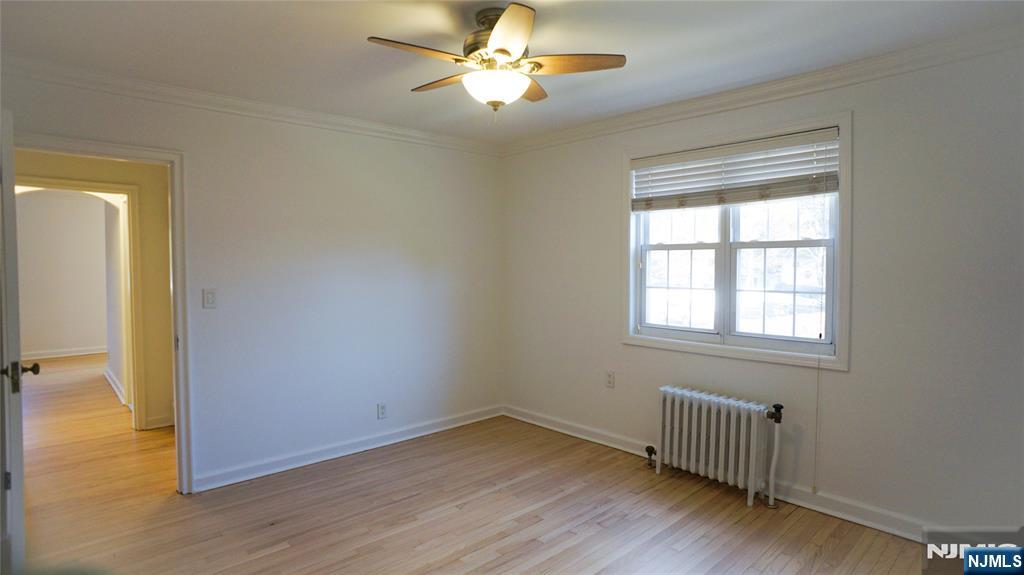 63 West Hudson Avenue, Unit C5 Englewood, NJ 07631 - Photo 16 of 19 a view of empty room with wooden floor and fan