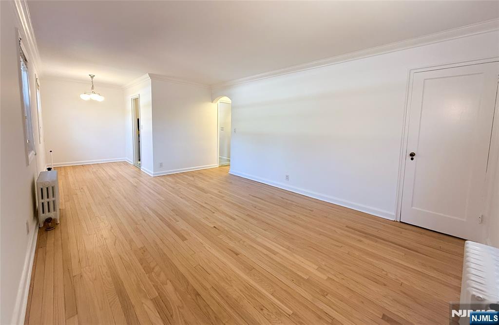 63 West Hudson Avenue, Unit C5 Englewood, NJ 07631 - Photo 7 of 19 a view of an empty room and wooden floor