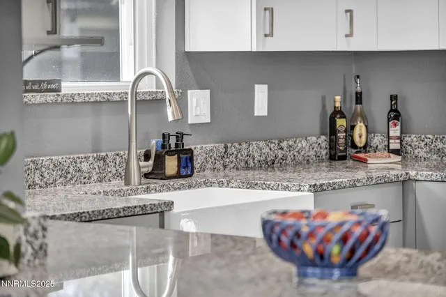 a kitchen with stainless steel appliances granite countertop a stove microwave and refrigerator