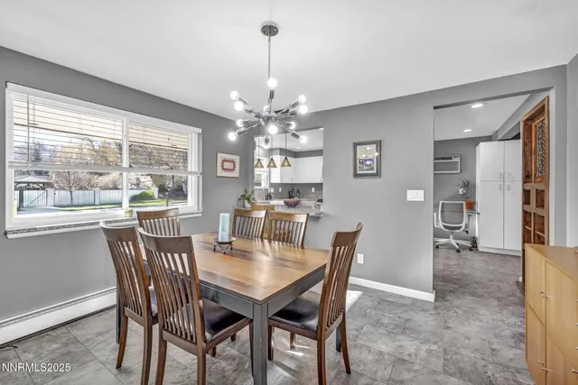 a view of a dining room with furniture window and outside view