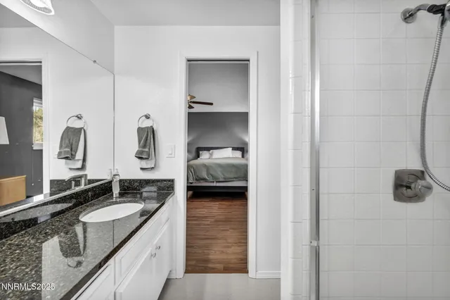a bathroom with a glass shower door