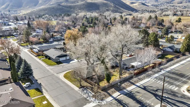 an aerial view of houses with yard