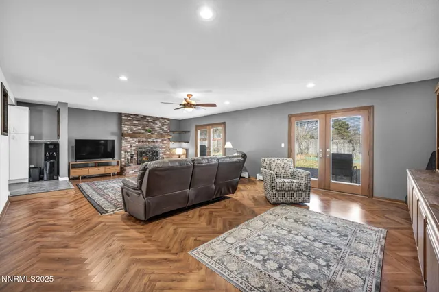 a living room with furniture window and wooden floor