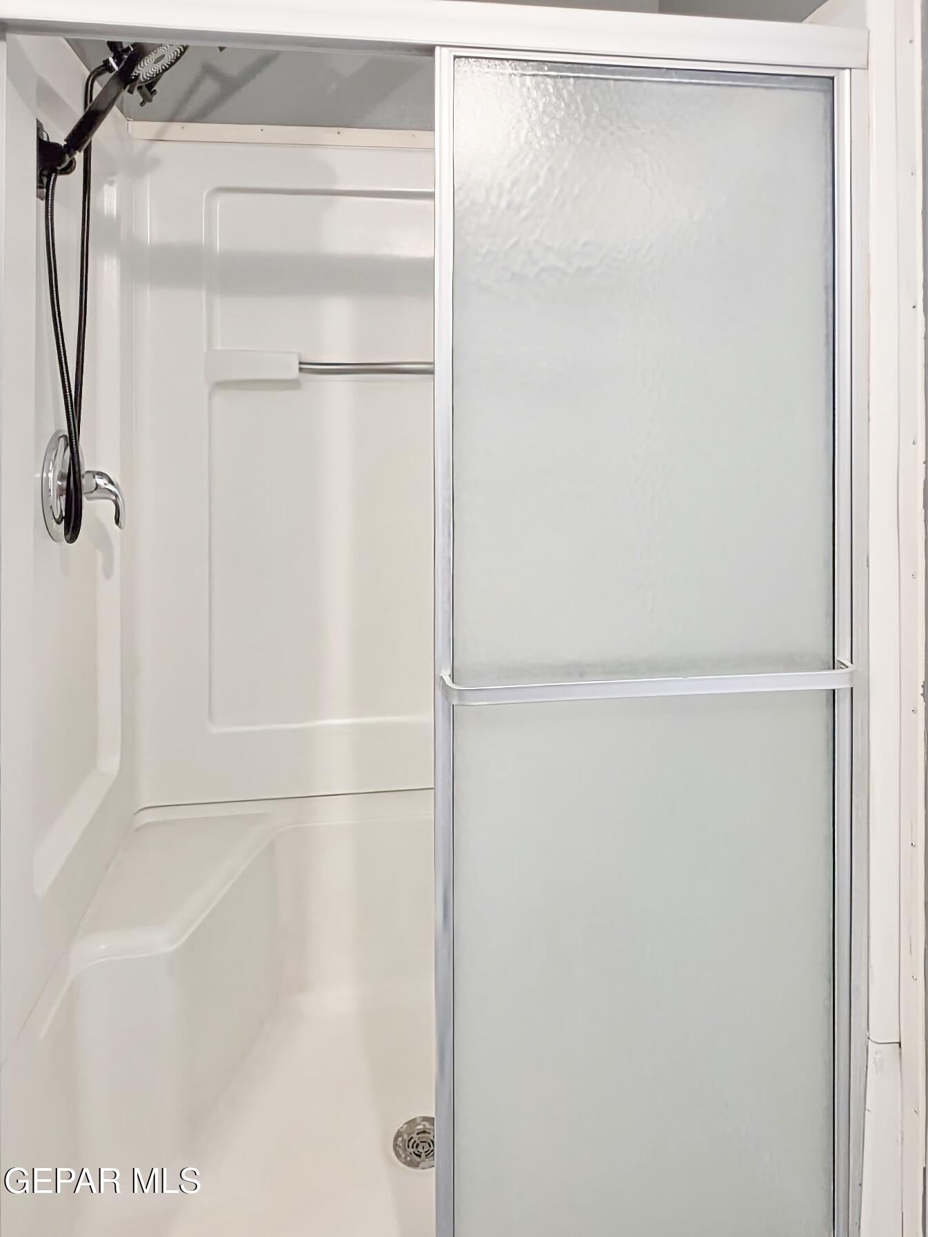 101 Clydesdale Road Dell City, TX 79847 - Photo 43 of 90 a bathroom with a glass shower door