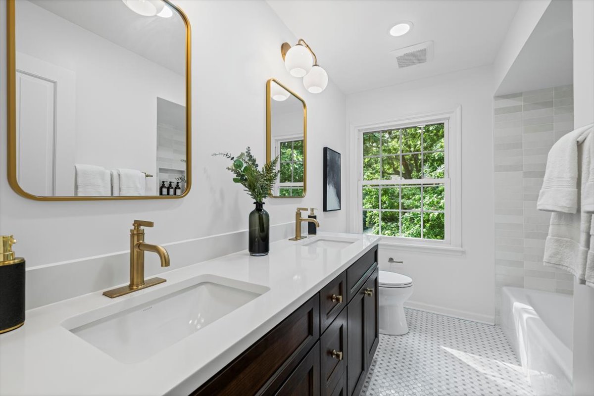 265 Randolph Street Glencoe, IL 60022 - Photo 18 of 34 a bathroom with a double vanity sink window and mirror
