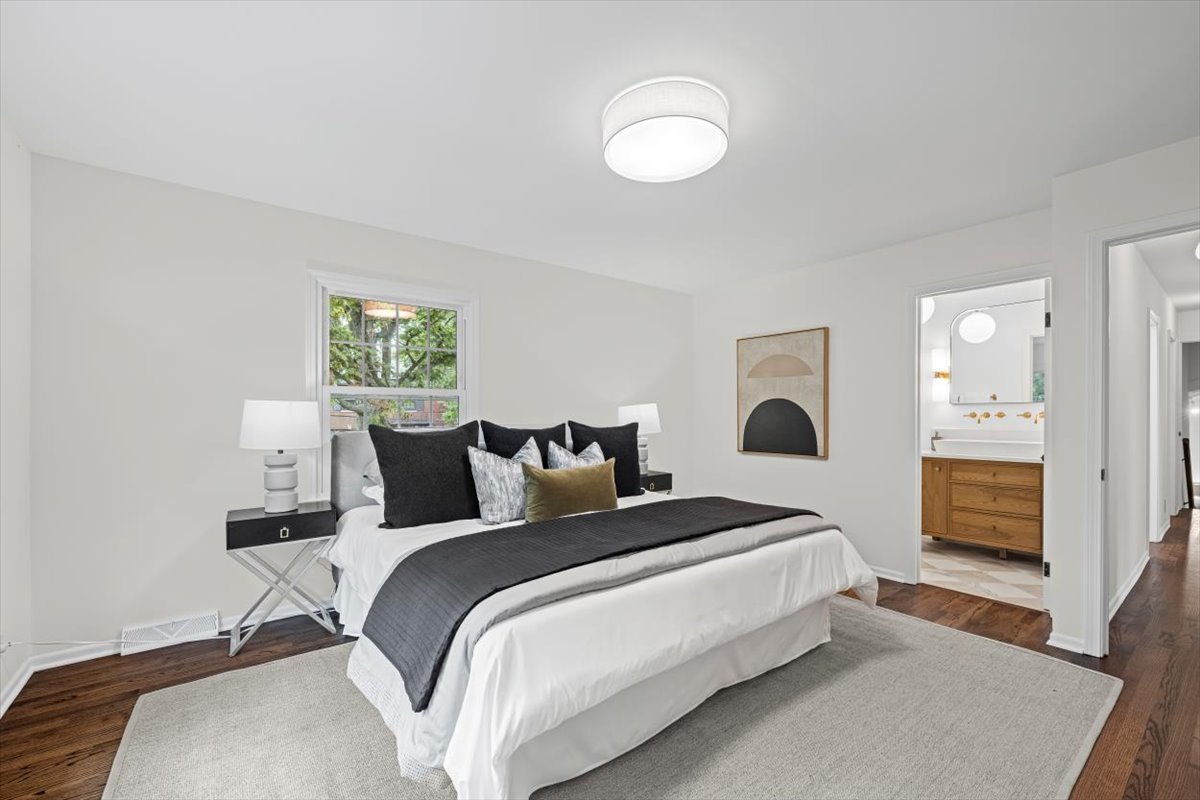 265 Randolph Street Glencoe, IL 60022 - Photo 24 of 34 a spacious bedroom with a bed and a window