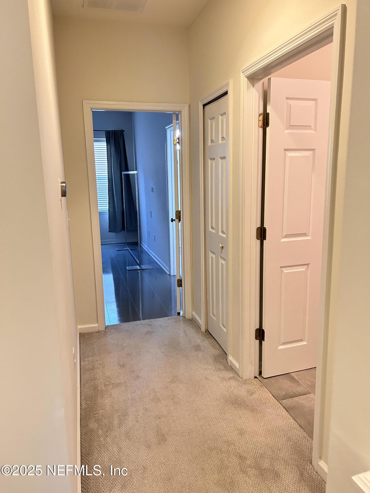 8617 Ribbon Falls Lane Jacksonville, FL 32244 - Photo 12 of 16 a view of a hallway with wooden floor