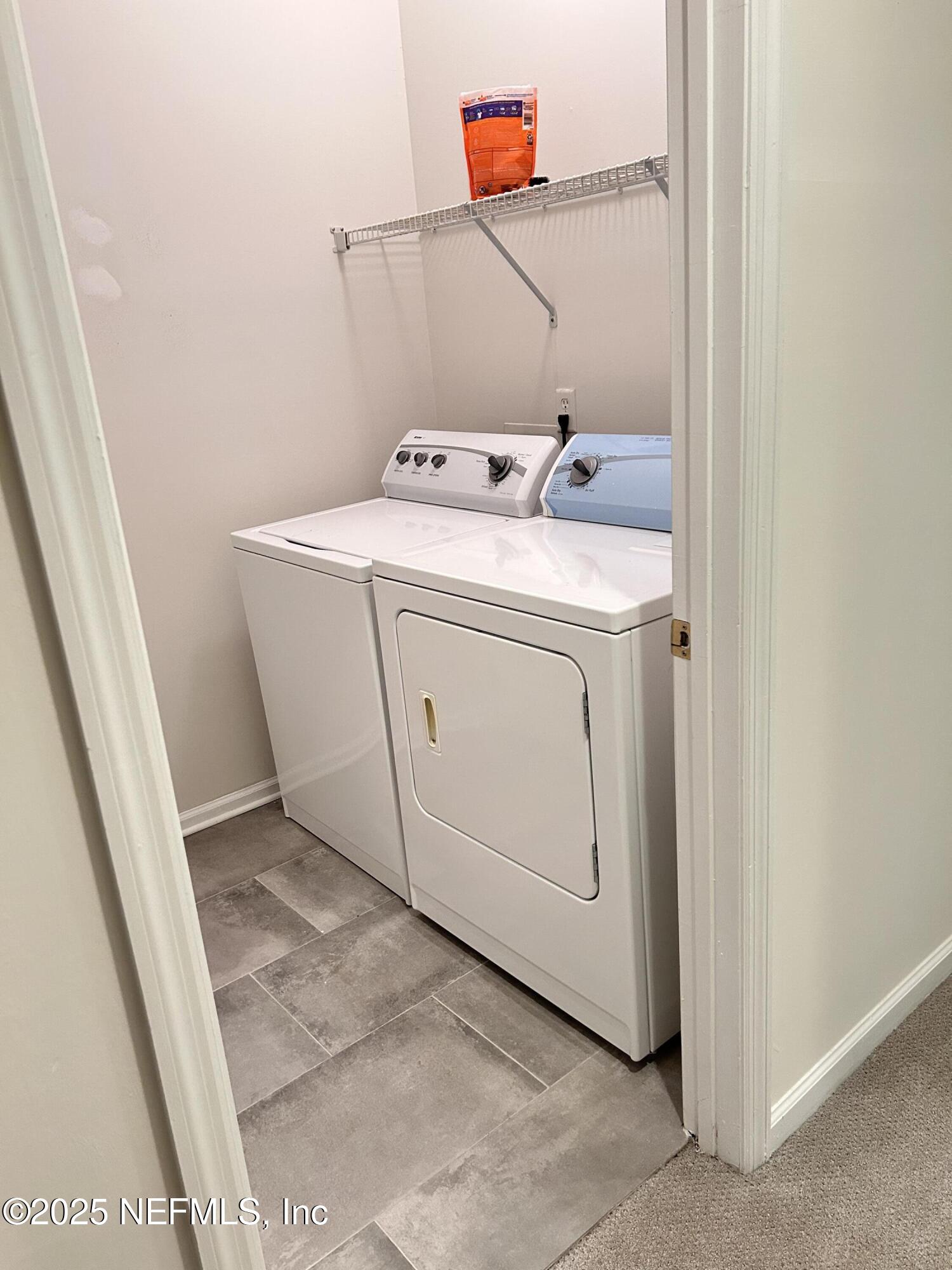 8617 Ribbon Falls Lane Jacksonville, FL 32244 - Photo 14 of 16 a utility room with dryer and washer