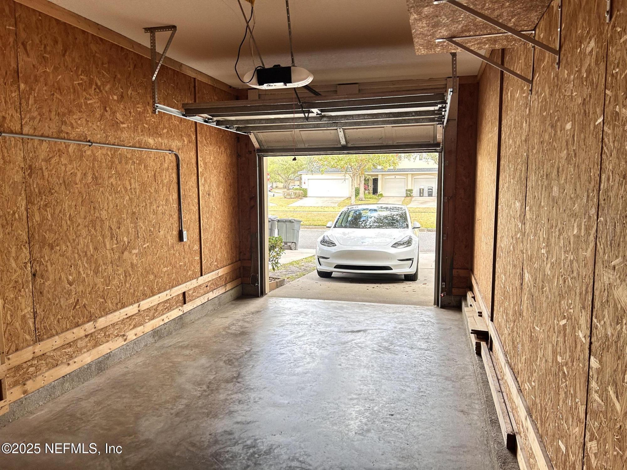 8617 Ribbon Falls Lane Jacksonville, FL 32244 - Photo 16 of 16 a view of a car garage door