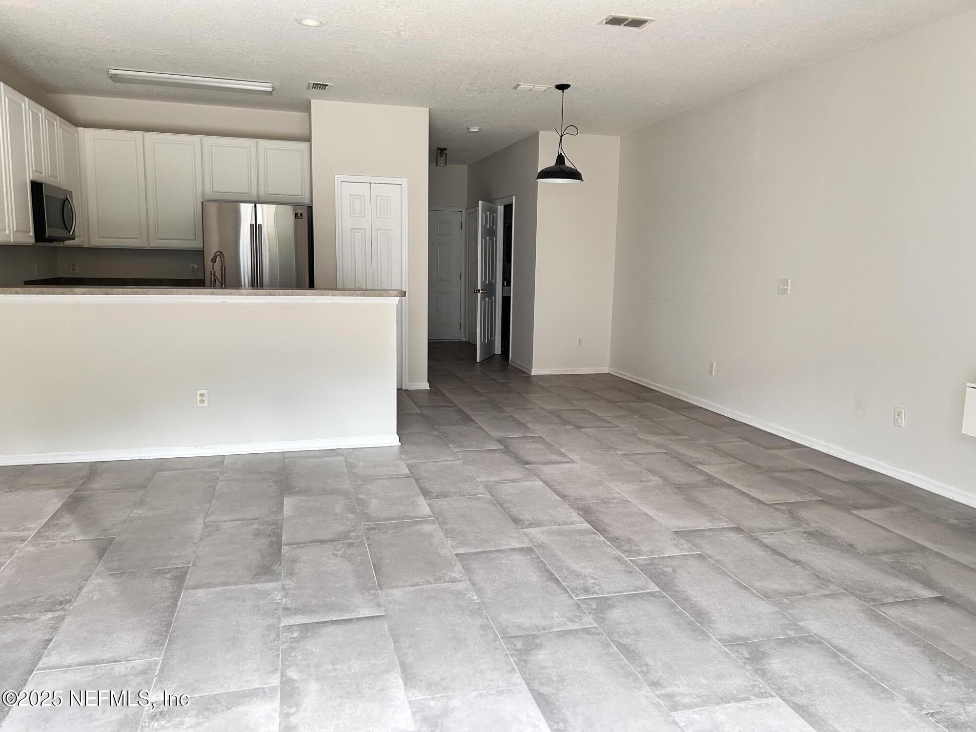 8617 Ribbon Falls Lane Jacksonville, FL 32244 - Photo 5 of 16 a view of a kitchen with a sink