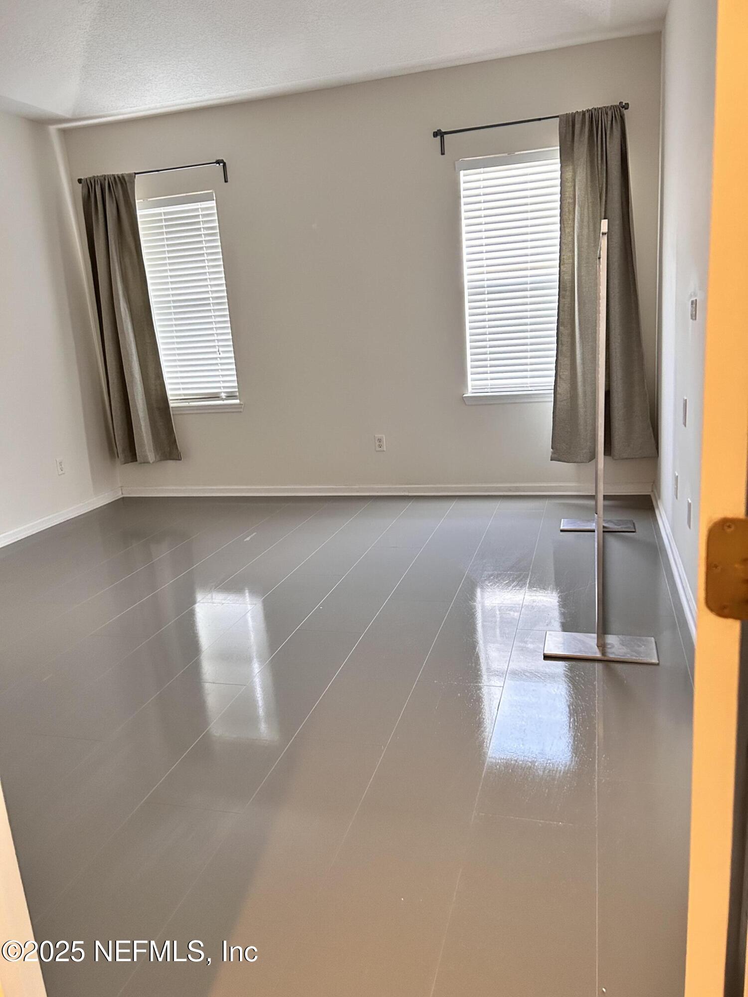 8617 Ribbon Falls Lane Jacksonville, FL 32244 - Photo 7 of 16 a bathroom with a bathtub