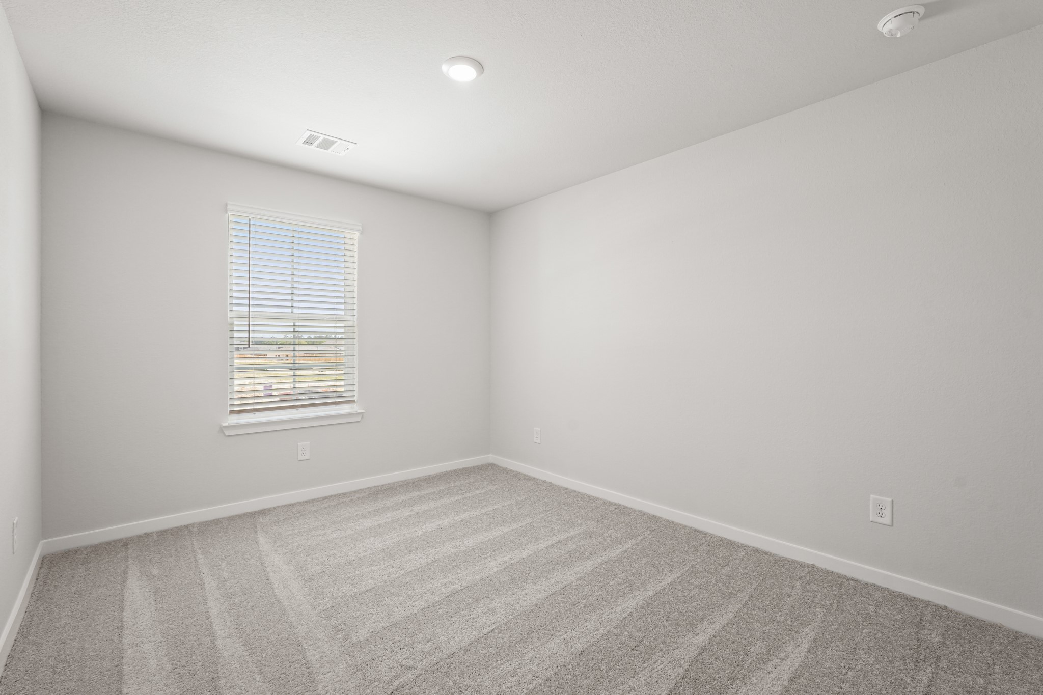217 Spring Drive Hockley, TX 77447 - Photo 20 of 27 an empty room with a window