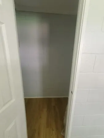 a view of an entryway with wooden floor