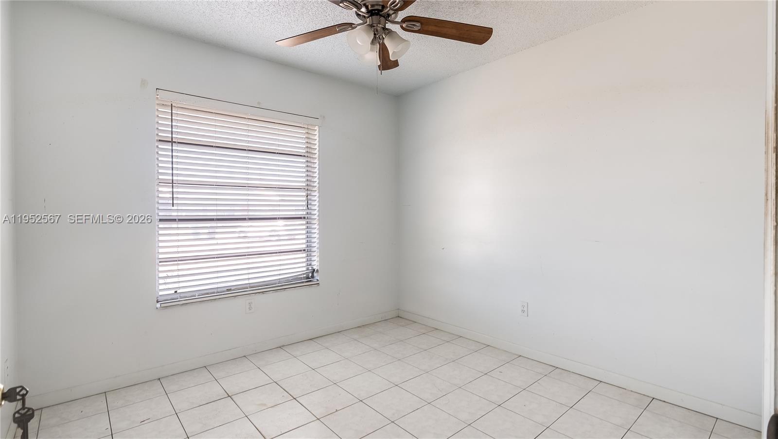 11405 Southwest 148th Terrace Miami, FL 33176 - Photo 15 of 28 a view of an empty room with a window