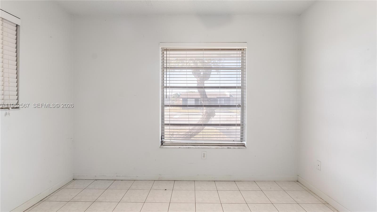 11405 Southwest 148th Terrace Miami, FL 33176 - Photo 18 of 28 an empty room with a window