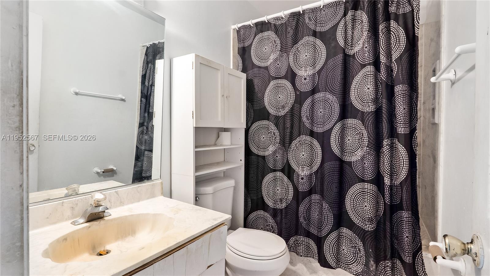 11405 Southwest 148th Terrace Miami, FL 33176 - Photo 19 of 28 a bathroom with a toilet sink and mirror