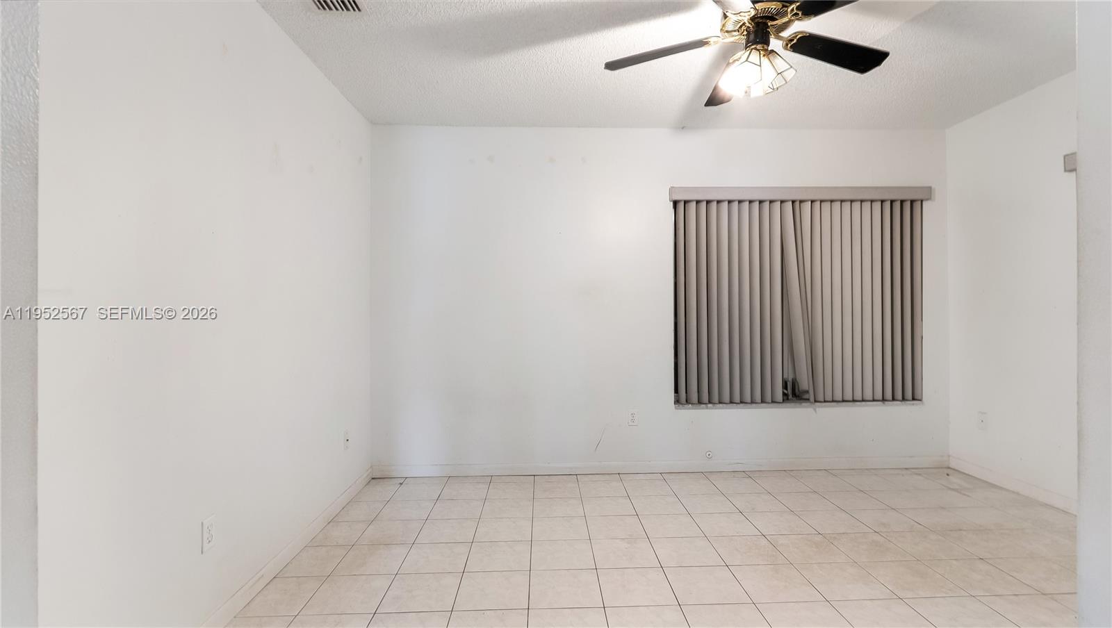 11405 Southwest 148th Terrace Miami, FL 33176 - Photo 20 of 28 an empty room with windows and fan