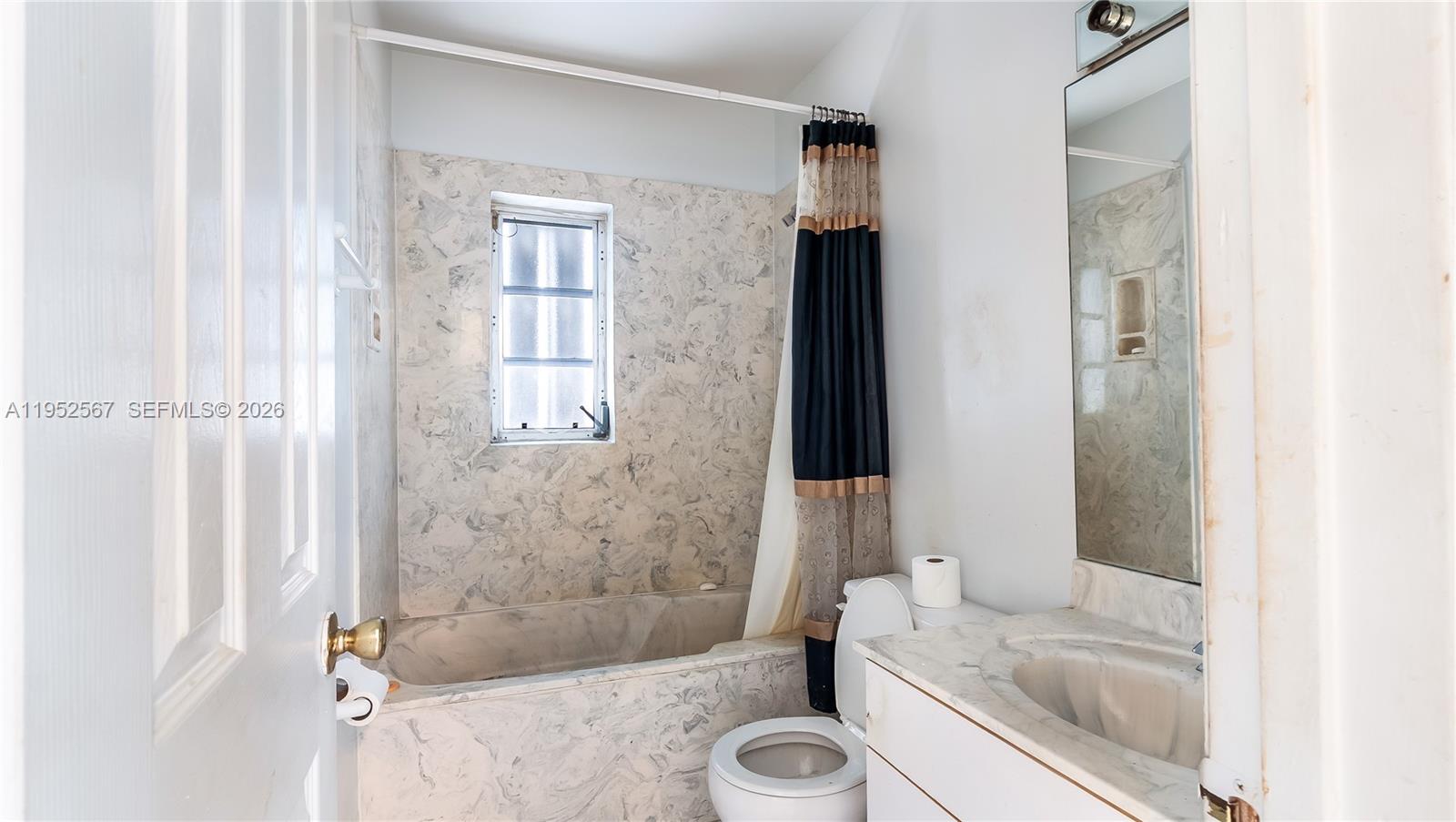 11405 Southwest 148th Terrace Miami, FL 33176 - Photo 23 of 28 a bathroom with a granite countertop bathtub shower and mirror