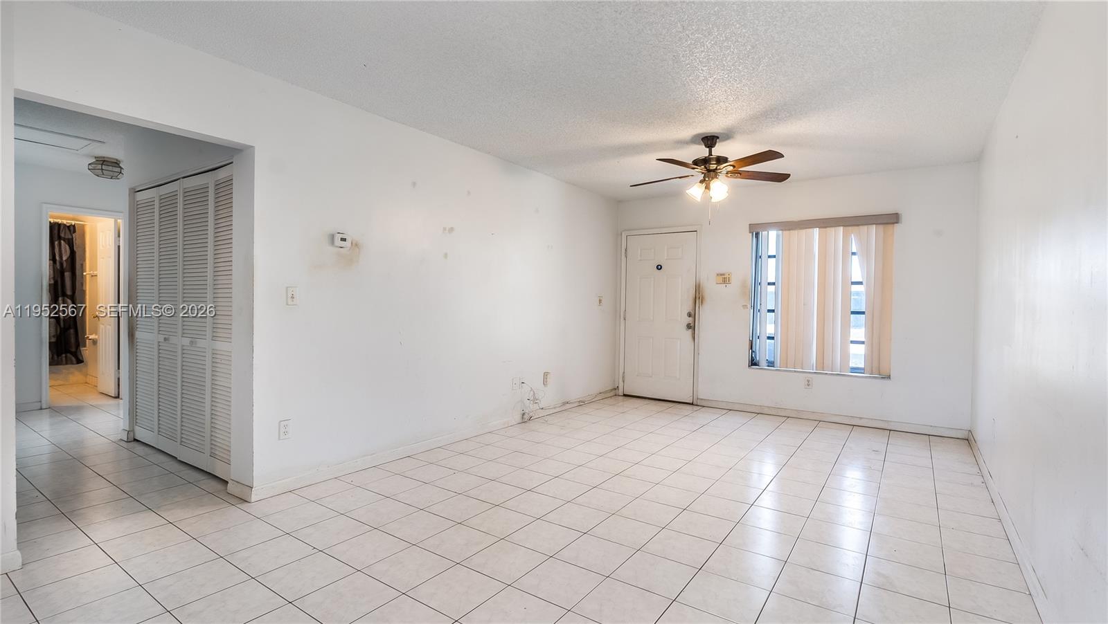 11405 Southwest 148th Terrace Miami, FL 33176 - Photo 4 of 28 a view of an empty room with window