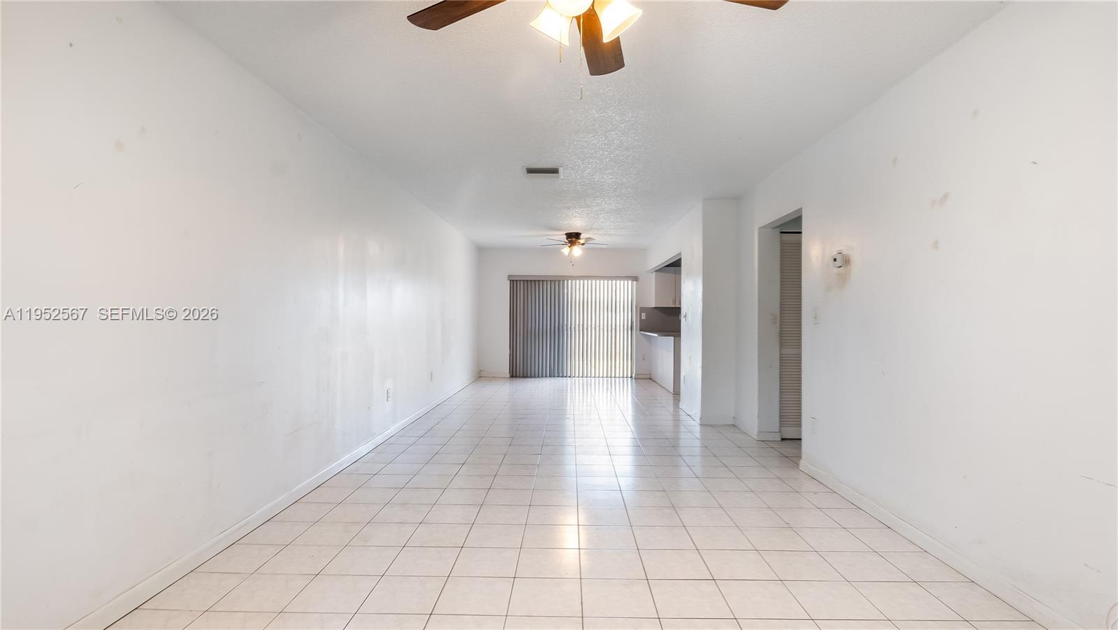 11405 Southwest 148th Terrace Miami, FL 33176 - Photo 5 of 28 a view of a hallway with closet and chandelier fan
