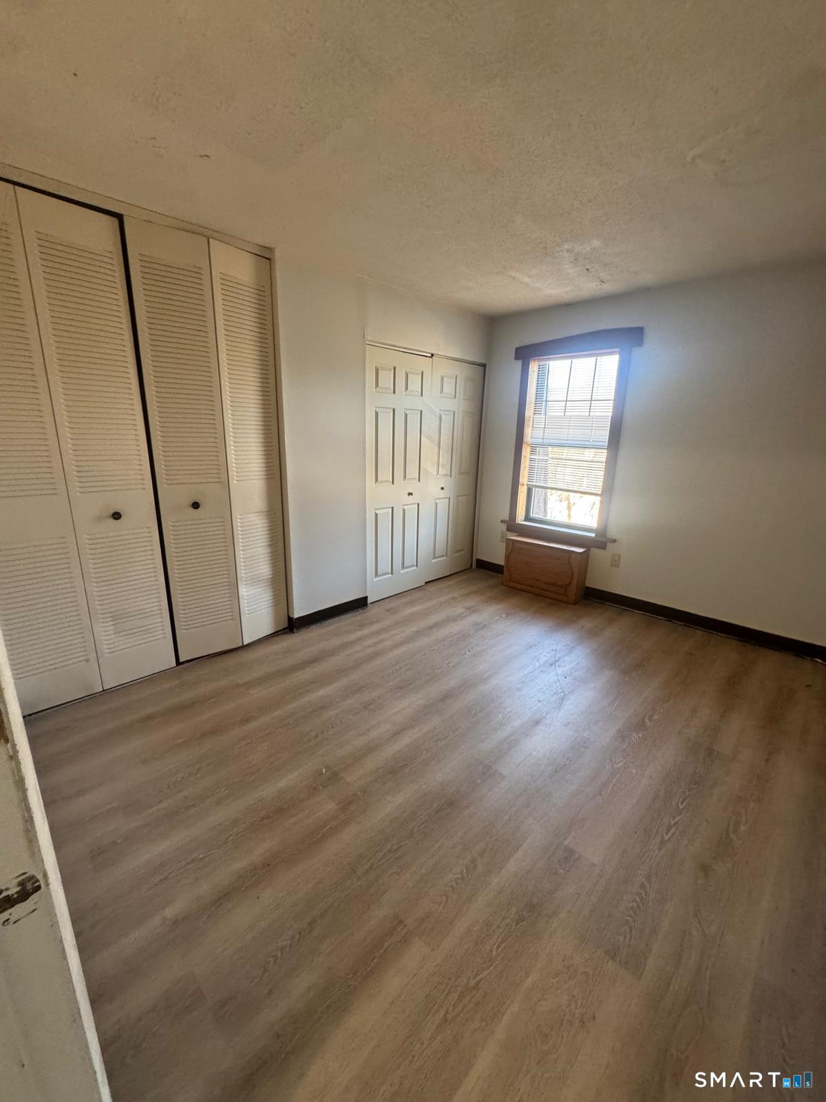 45 Stevens Street, Unit 5 Bridgeport, CT 06606 - Photo 3 of 8 a view of an empty room with a window
